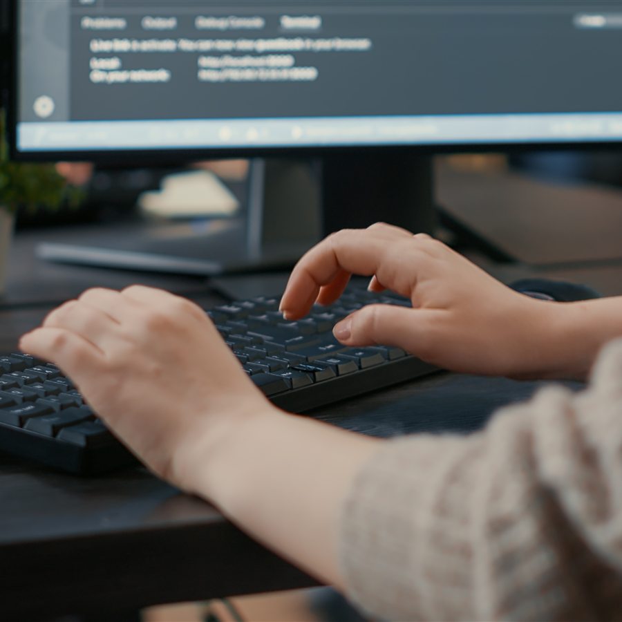 Student typing code in a Java programming environment